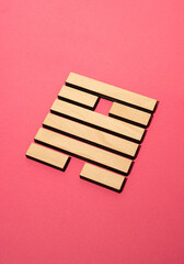 Gene Key 50 wood hexagram i ching on pink background