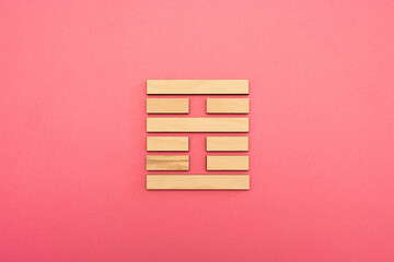Gene Key 21 Hexagram wood i ching on pink background