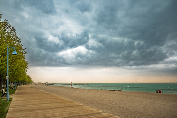 A storm cell moves over a beach on Lake Ontario.  Shot in Toronto's Beaches neighbourhood in May....