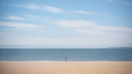 Fototapeta na wymiar lonely man on a beach