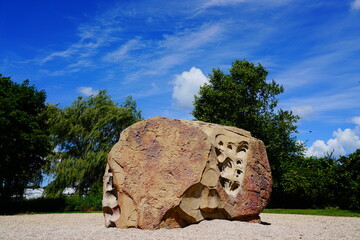 Giant boulder rock sits in Ripon, Wisconsin park to allow children to climb on it.