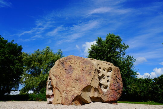 Giant boulder rock sits in Ripon, Wisconsin park to allow children to climb on it.