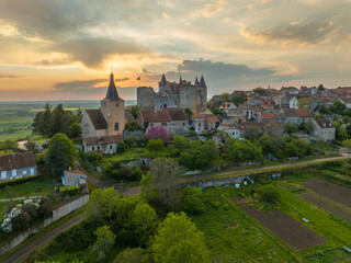 Aerial view of Châteauneuf-en-Auxois castle and medieval village one of the most beautiful villages of France with colorful sunset sky