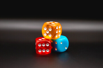 colored casino or gambling dice on a black background