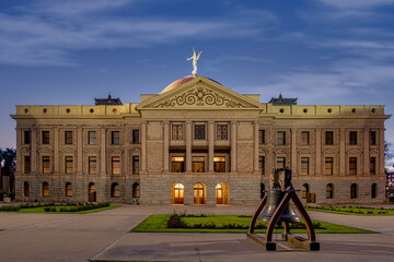 Illuminated Arizona State Capitol with Liberty Bell at dusk