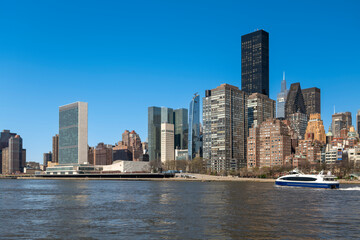 Fototapeta na wymiar New York City skyscrapers on the river canal. High-quality photo
