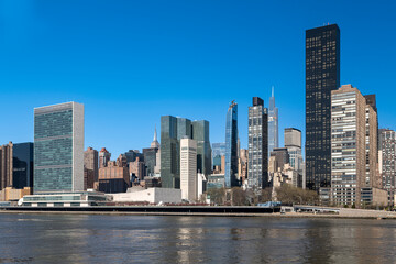 Fototapeta na wymiar New York City skyscrapers on the river canal. High-quality photo