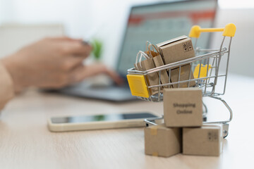 internet shopping e commerce concept, Parcel boxes of product on laptop computer related buy from...