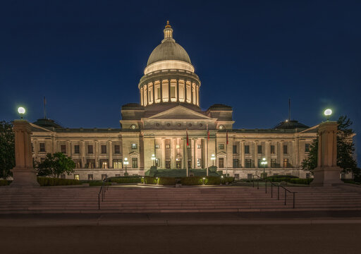 Arkansas State Capitol at night with lights glowing from dome at night.  