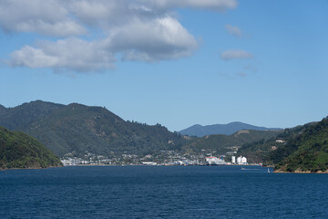 Small port town of Picton in distance as ferry arrives from Wellington