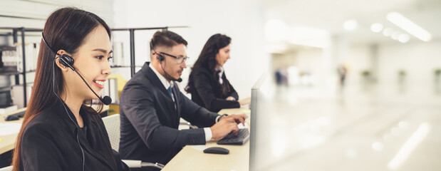 Business people wearing headset working in office to support remote customer or colleague. Call...