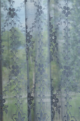 translucent curtain with green nature background