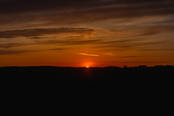 Clouds and sky at sunset in the horizon.