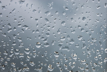 Texture on glass with raindrops.