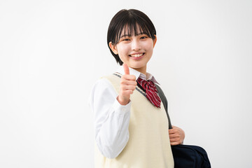 サムズアップをする女子高校生