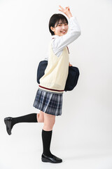 ピースサインをする女子高校生