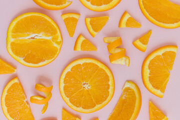 Organic Orange slices on a pink background