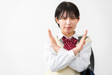 NGサインをする女子高校生