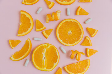 Organic Orange slices on a pink background