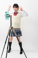 ダンスビデオを録画する女子高校生
