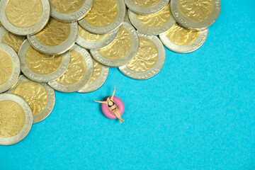 Miniature people toy figure photography. Budget and Financial Plan for travel. Girl wearing black...