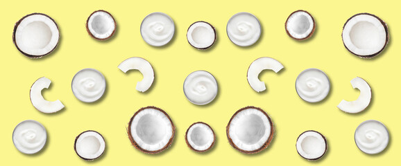 Jars with natural cosmetic cream and coconuts on yellow background. Pattern for design