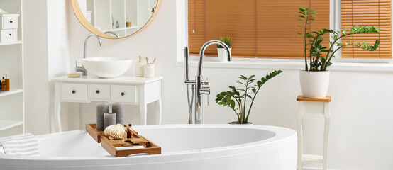 Stylish interior of modern bathroom with bathtub © Pixel-Shot