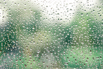 Texture on glass with raindrops.