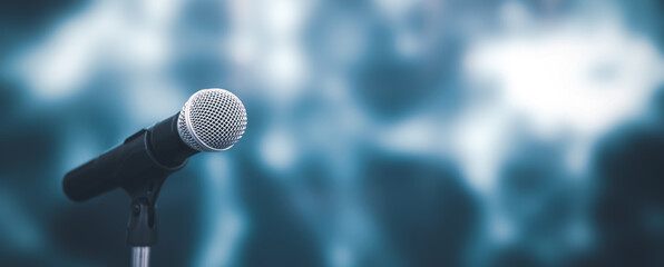 Microphone with stage light background for performance concept of speech comment and public speaking