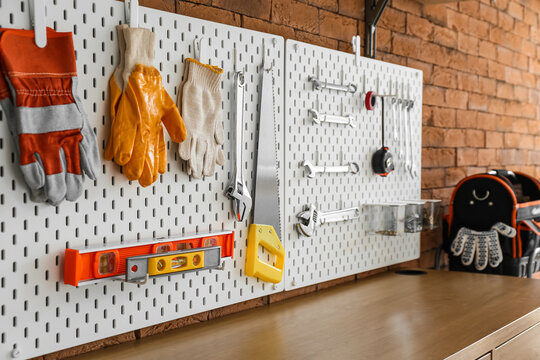 Pegboards with different tools in workshop