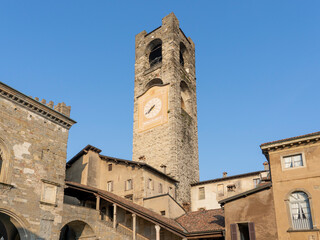 Fototapeta premium Bergamo, Italy. The old town. Landscape at the clock tower called Il Campanone. It is located in the main square of the upper town. Bergamo one of the most beautiful in Italy