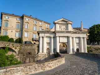 Obraz premium Bergamo, Italy. The old town. Amazing view at the ancient gate Porta San Giacomo. Bergamo one of the most beautiful cities in Italy. Tourists destination. Bergamo Italian capital of culture 2023