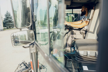 A city cleaning worker driving street washing vehicle.