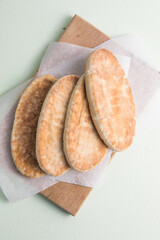 Pita bread on wooden board, Greek bread