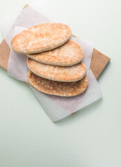 Pita bread on wooden board, Greek bread