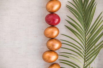 Golden  eggs. The minimal concept. An Easter card with a copy of the place for the text.