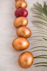 Golden  eggs. The minimal concept. An Easter card with a copy of the place for the text.