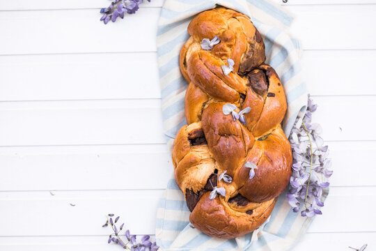 Tsoureki traditional baked Greek Easter sweet bread.  Easter time, springtime. Holiday food concept. Top view, flat lay, copy space