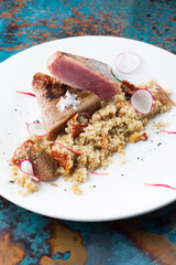 Fish and seafood in a plate. Photo of food on a white background