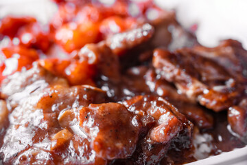 Chinese American food, fried chicken pieces in a common sauce, close-up, macro photography, shallow depth of field. Concept, delicious food