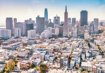 Beautiful aerial view from the Coit Tower to downtown San Francisco, magnificent skyscrapers of the famous American city. Photo edited in pastel colors.