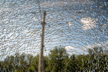cracked glass in the bus, street view, close-up