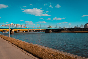 Fototapeta na wymiar A closer look at the Vistula River that flows in the middle of the city of Krakow and the bridges over it - Poland.