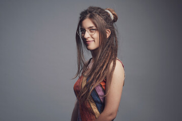 Portrait of young woman with piercing,  dreadlocks and long hair￼