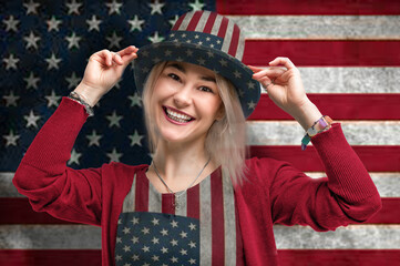 Independence Day. Happy young woman dressed in american flag clothes on american flag background