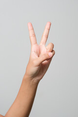 Hand with two fingers up in the peace or victory symbol