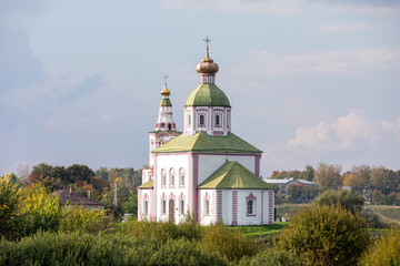The Church of Elijah the Prophet was built in 1744 and is located in the bend of the Kamenka River, opposite the Suzdal Kremlin. Religion concept. Suzdal, Vladimir region, Russia - SEPTEMBER 12, 2021