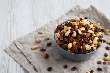 Raw Trail Mix with Nuts and Fruits in a Bowl, side view. Copy space.