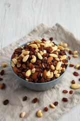 Raw Trail Mix with Nuts and Fruits in a Bowl, side view.