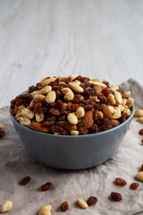 Raw Trail Mix with Nuts and Fruits in a Bowl, side view.
